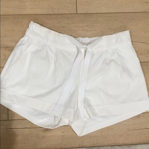 White lululemon cuff shorts with tie